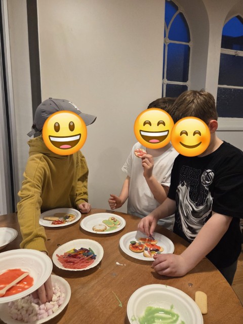 Boys sampling the food they've made - with emojis covering their faces for privacy